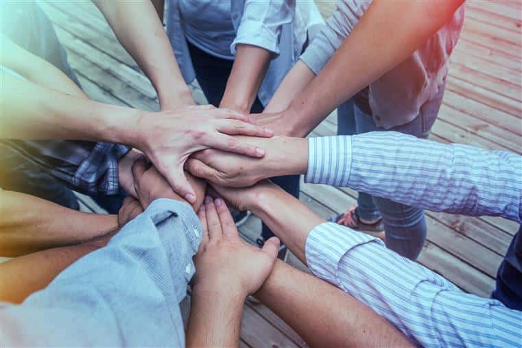 a group of hands holding each other