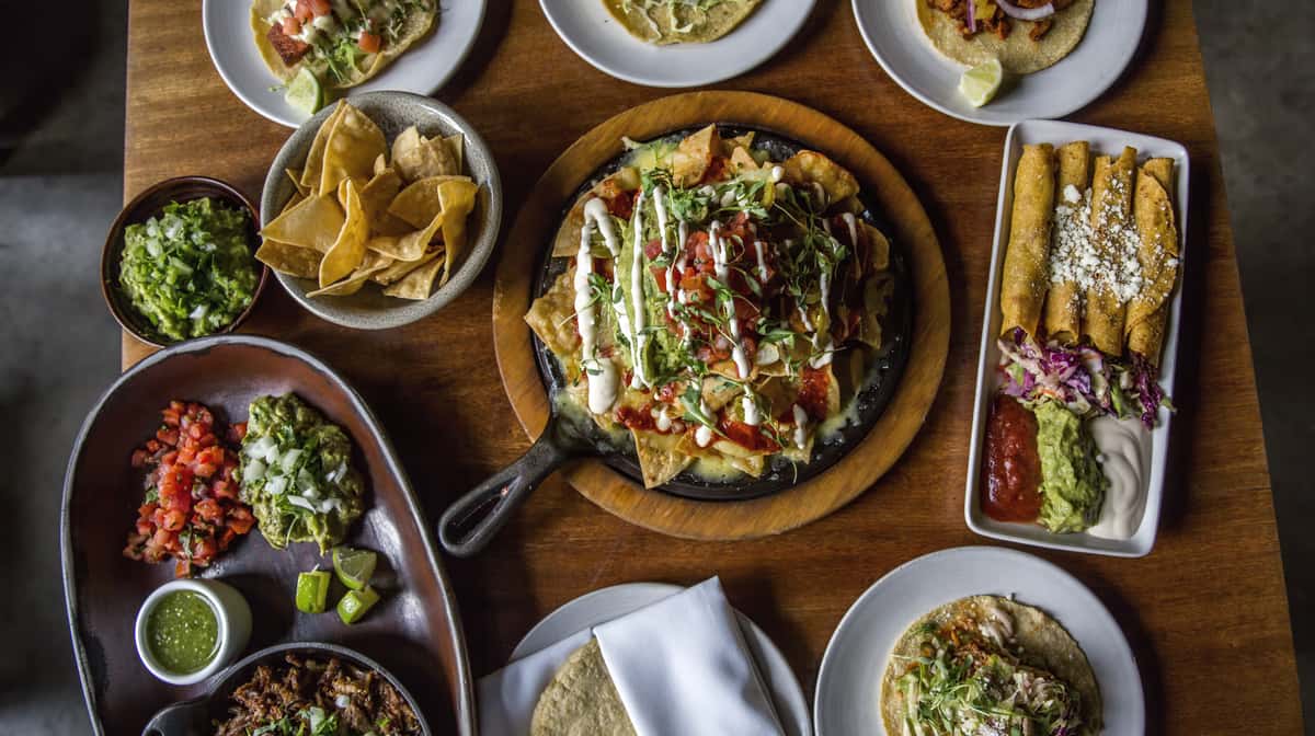 various Mexican dishes on a table