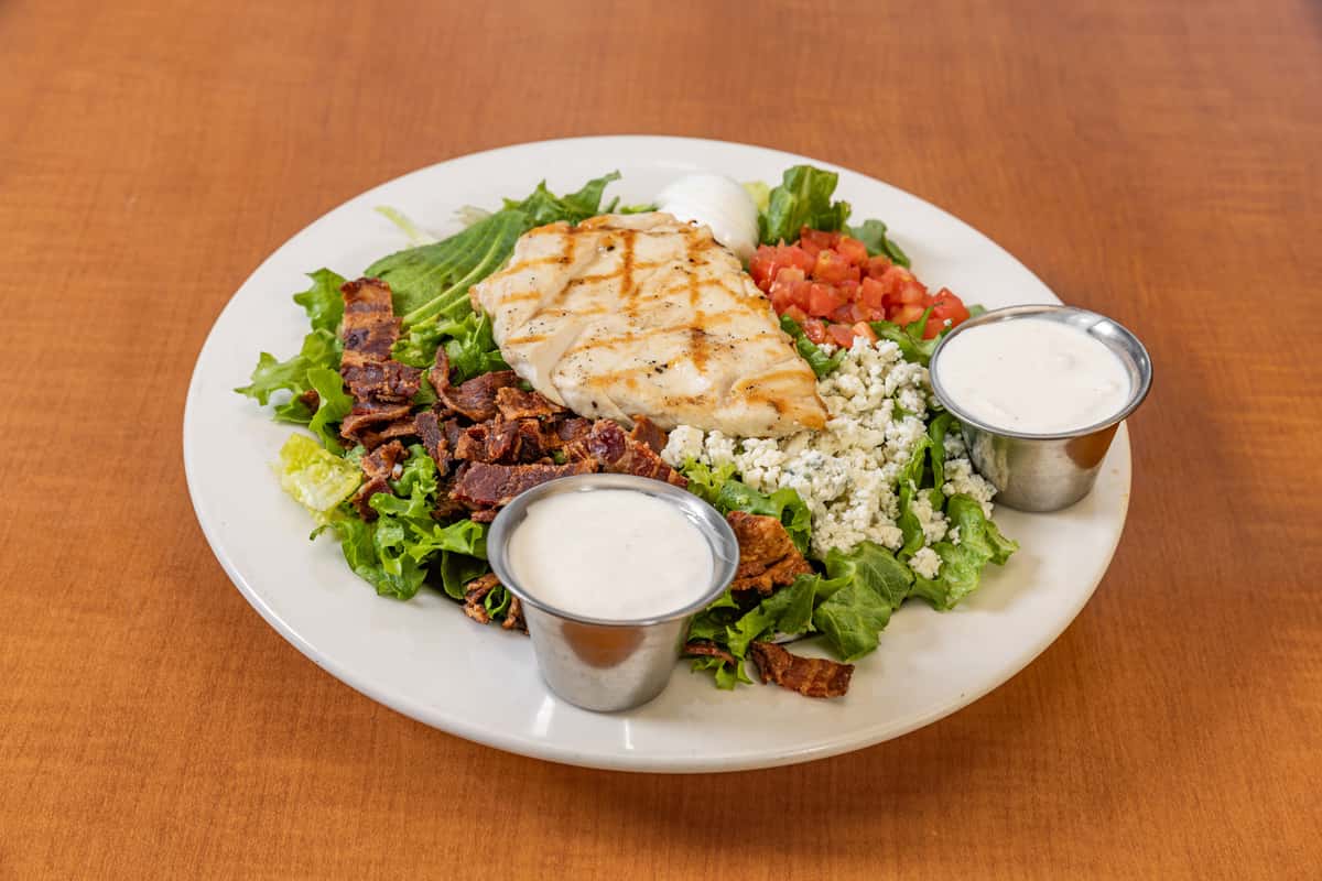 Fresh and colorful Cobb Salad with grilled chicken, avocado, and blue cheese, available for dining or catering in Snohomish.