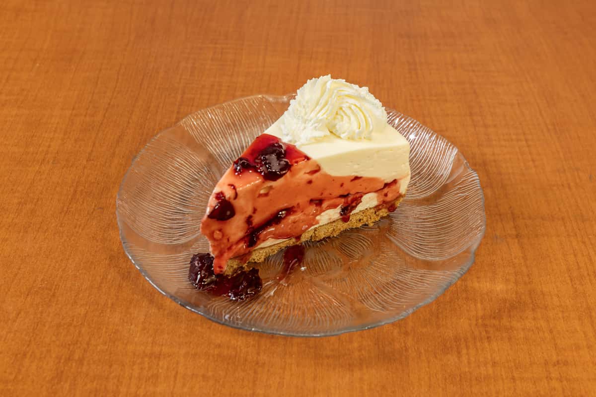 A slice of homemade Cherry Cheesecake, a popular dessert choice at Collector's Choice Restaurant in Snohomish, WA.