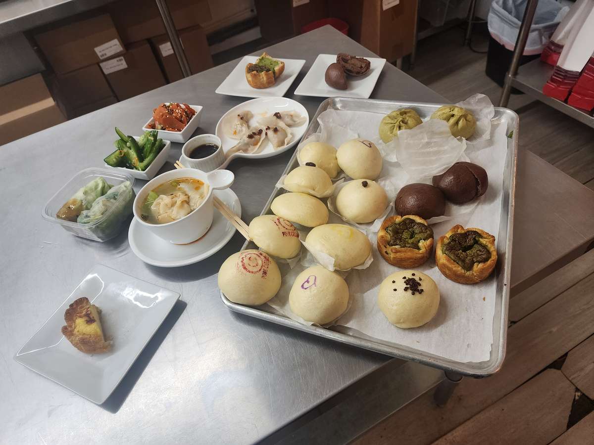 Buns on a tray with other dishes