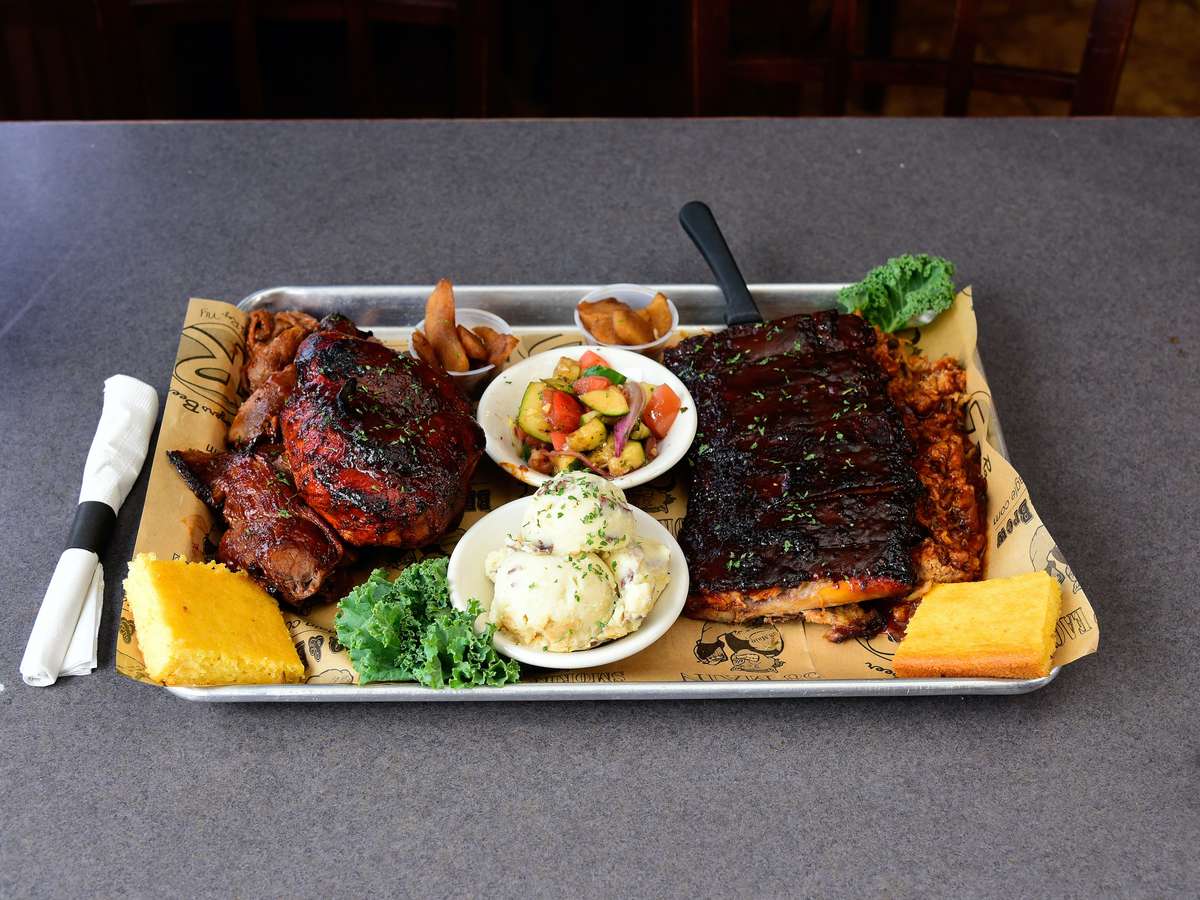 1/2 rack of ribs, 1/2 chicken & 1/2 lb of beef brisket, 1/2 lb pulled pork, double cornbread and double baked apples.