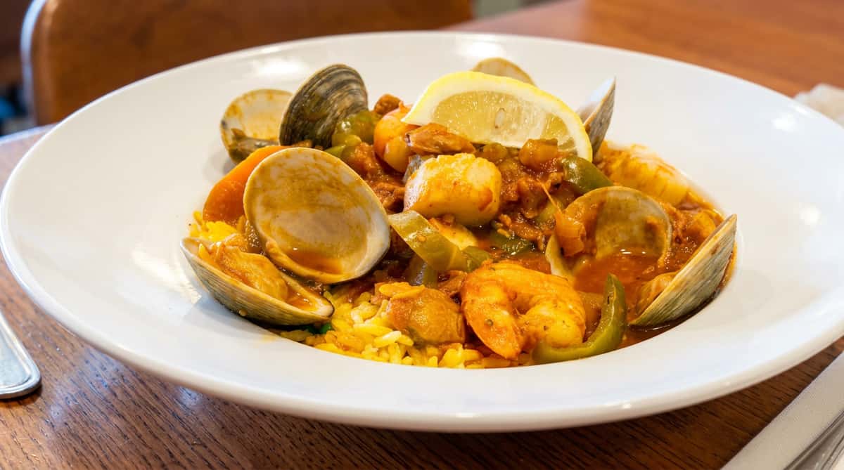 Portuguese-style seafood paella with shrimp, clams, sausage, and seasoned rice at Roger's Family Restaurant in Somerset MA