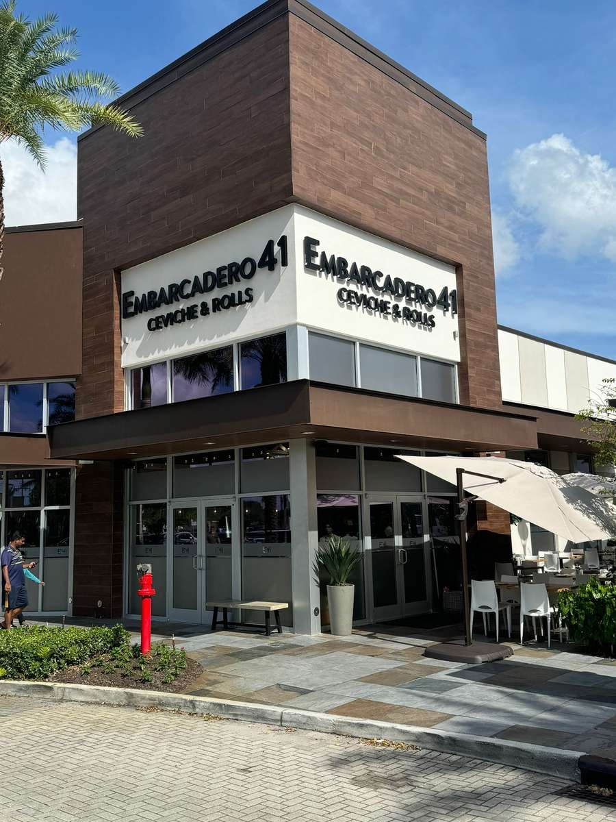 Exterior of restrauant showcasing building and signage