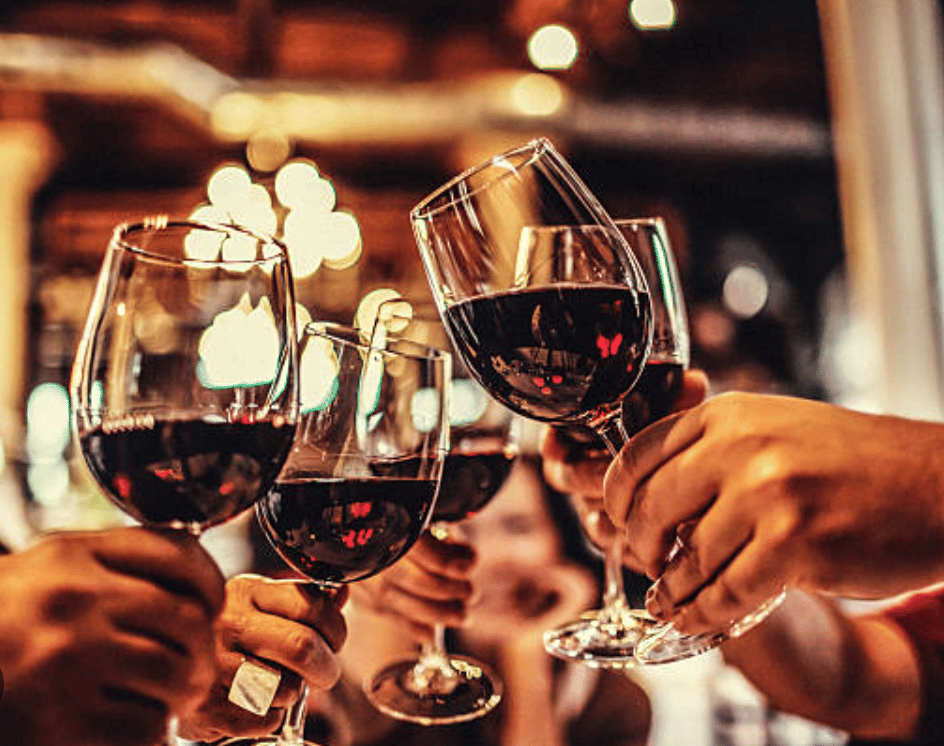 Photo of wine glasses cheersing & enjoying the party