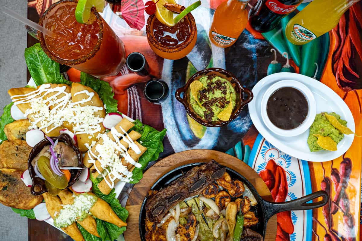 Multiple bright and colorful mexican dishes