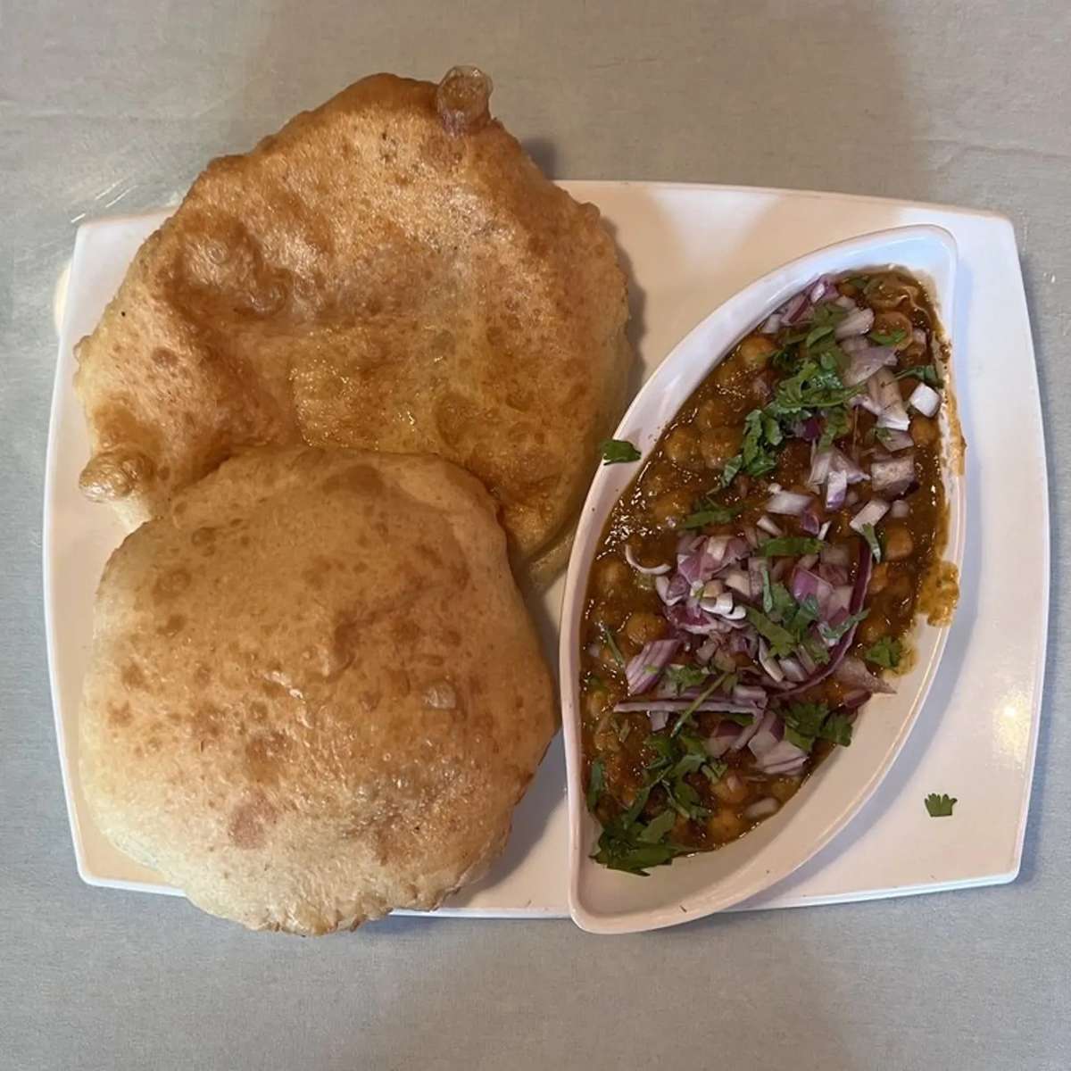 Curry served with a side of handmade bread