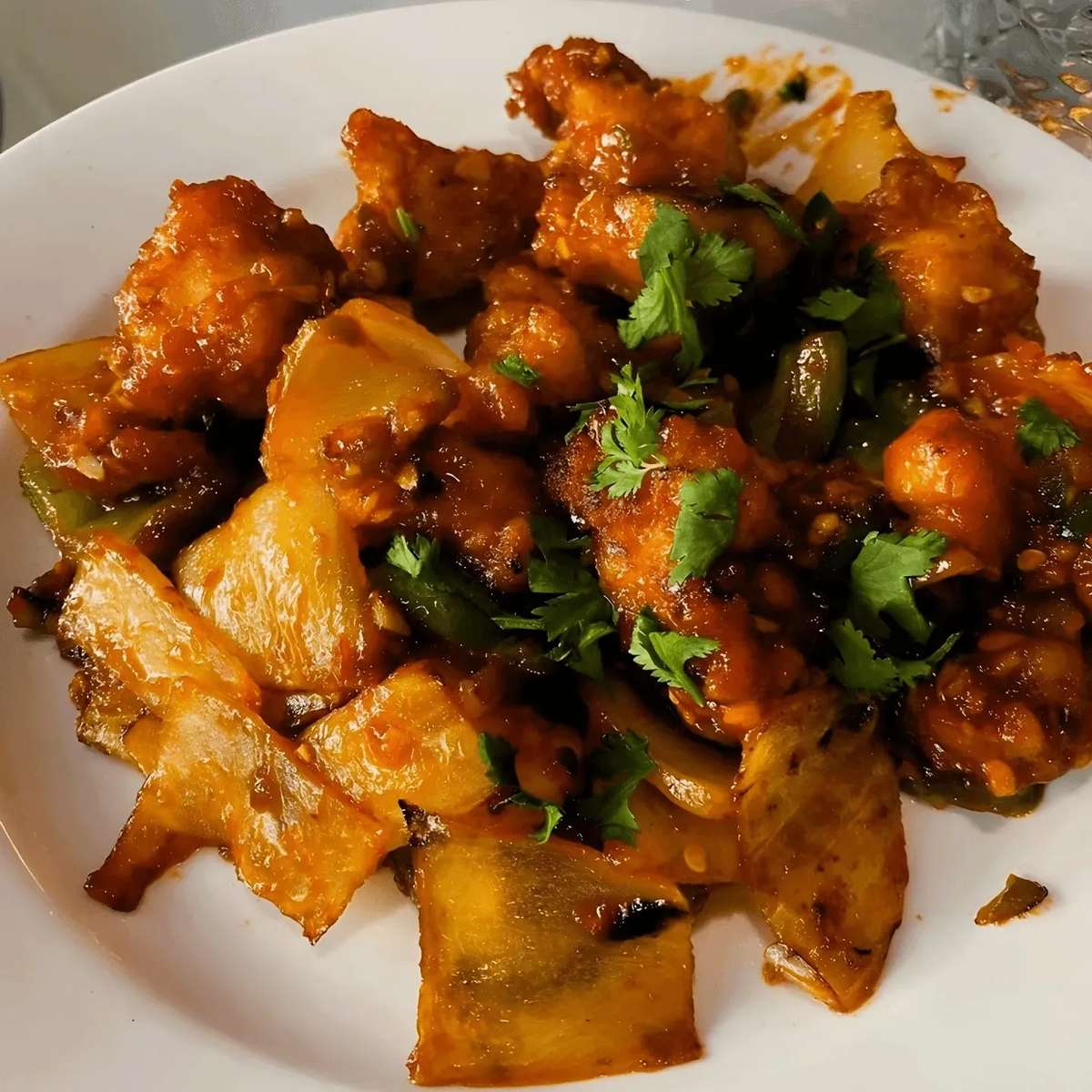 Mixed curry topped with seasoned with herbs