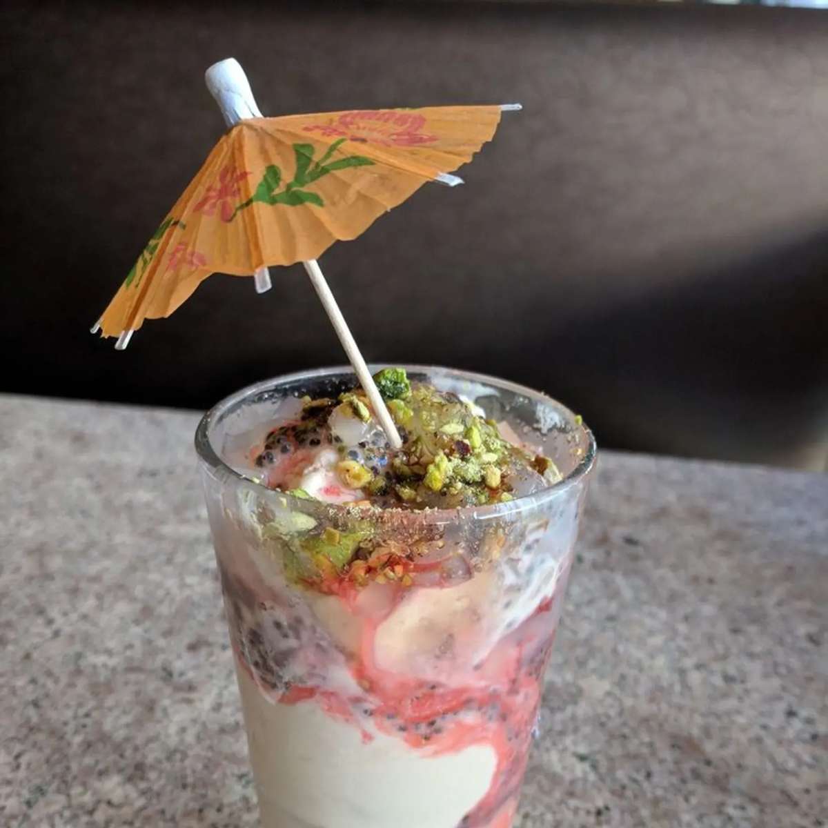 Flavored drink topped with a decorative umbrella