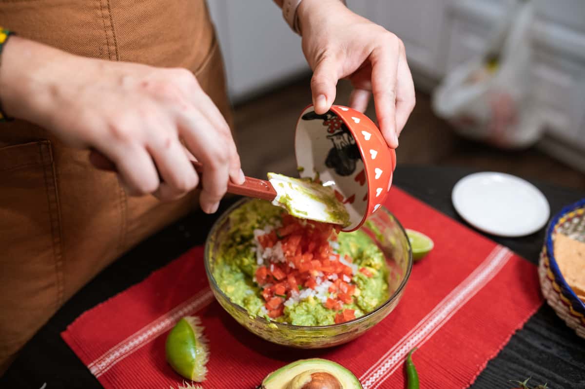 preparing guacamole