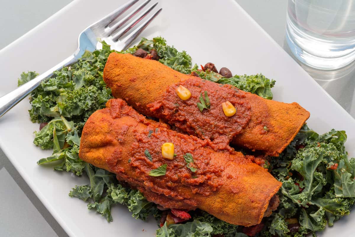 tamales on a bed of kale