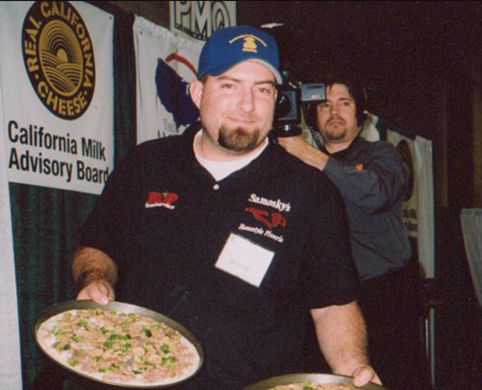 owner holding two pies