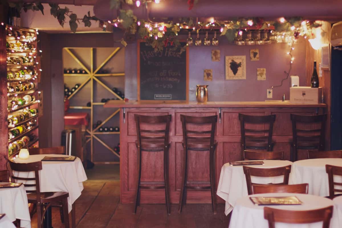 Bar area with bar countertop and stools