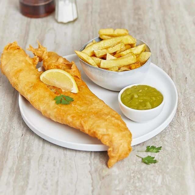 Fish and chips served with a sauce