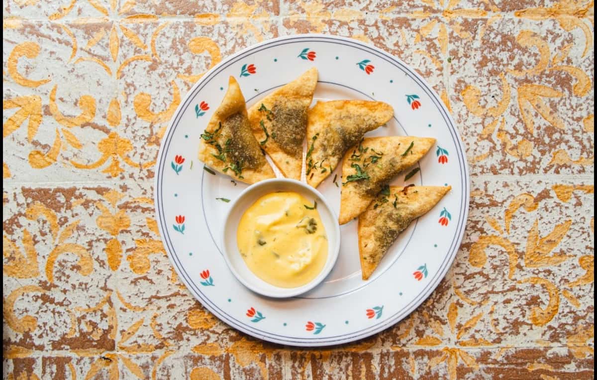 Five Wonton Dough Wrapped short rib mini empanadas, served with aji amarillo aioli