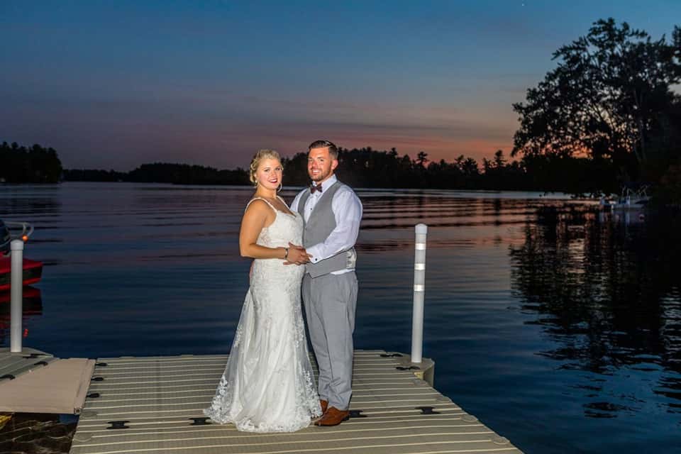 couple on dock at sunset