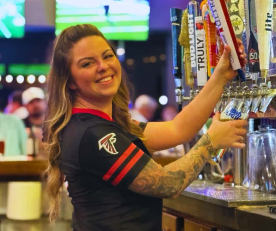 Melissa pouring beer