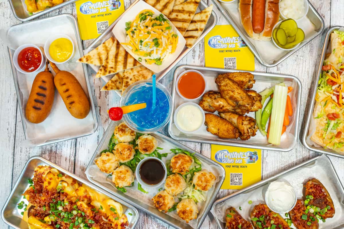 Group shot of food including chicken wings and more