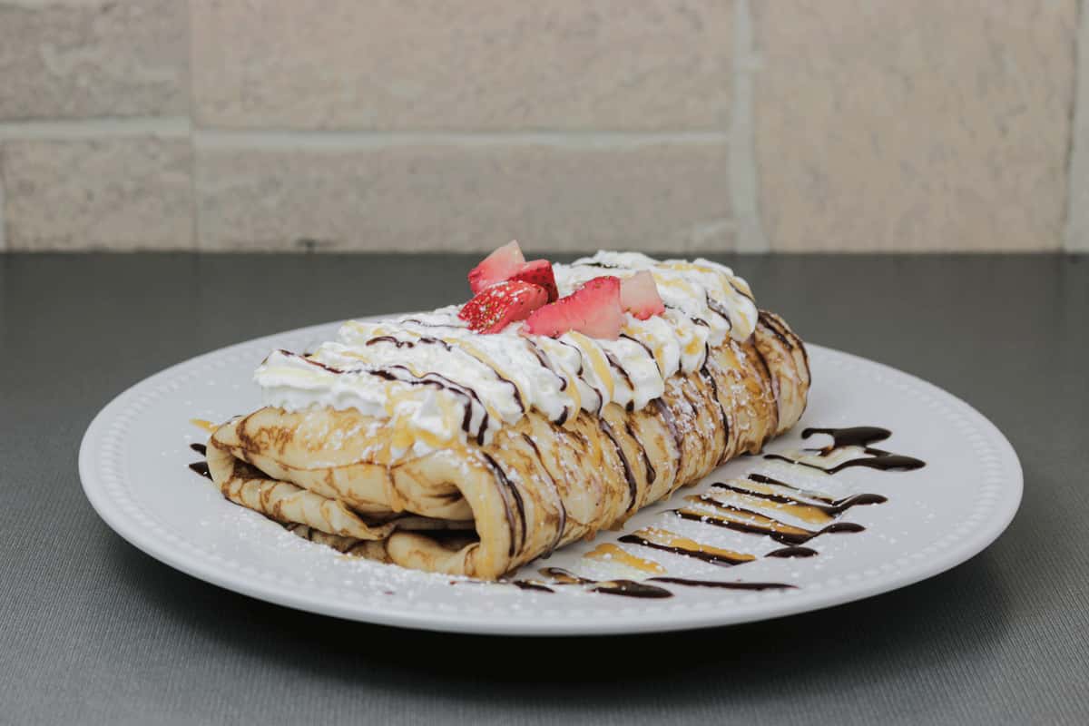 crepe with strawberries and whip cream