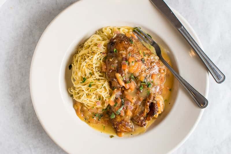 Boneless smoked half duck served over linguine and with Chef's special orange sauce, diced tomatoes and onions.