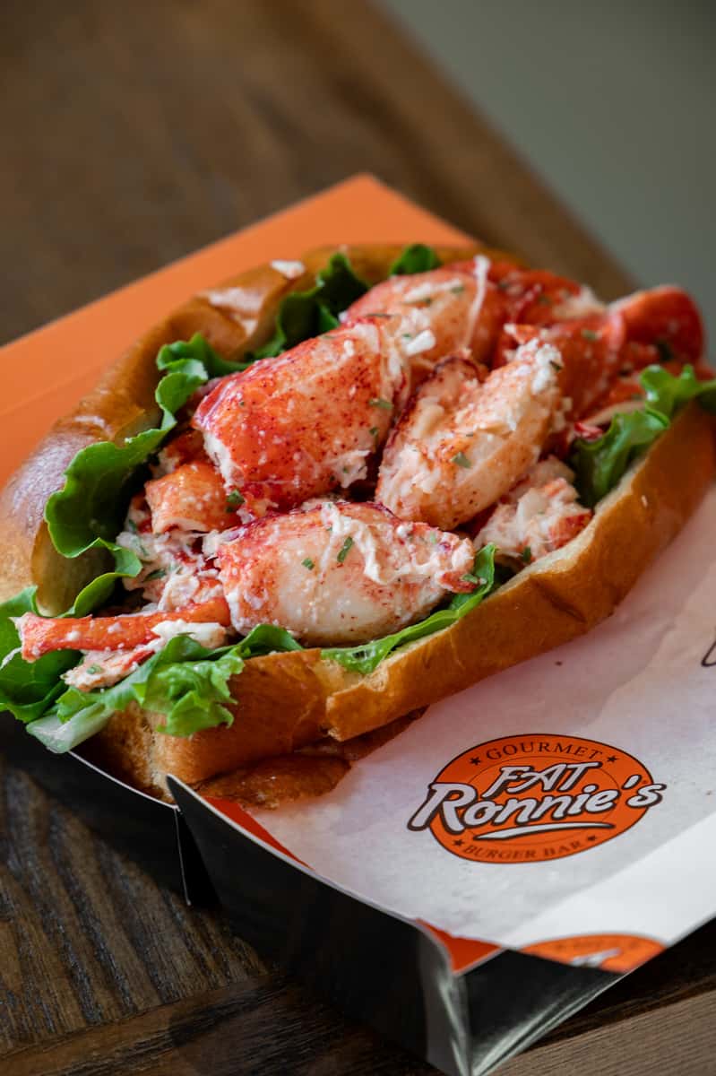 Lobster roll filled with fresh lobster meat in a toasted bun