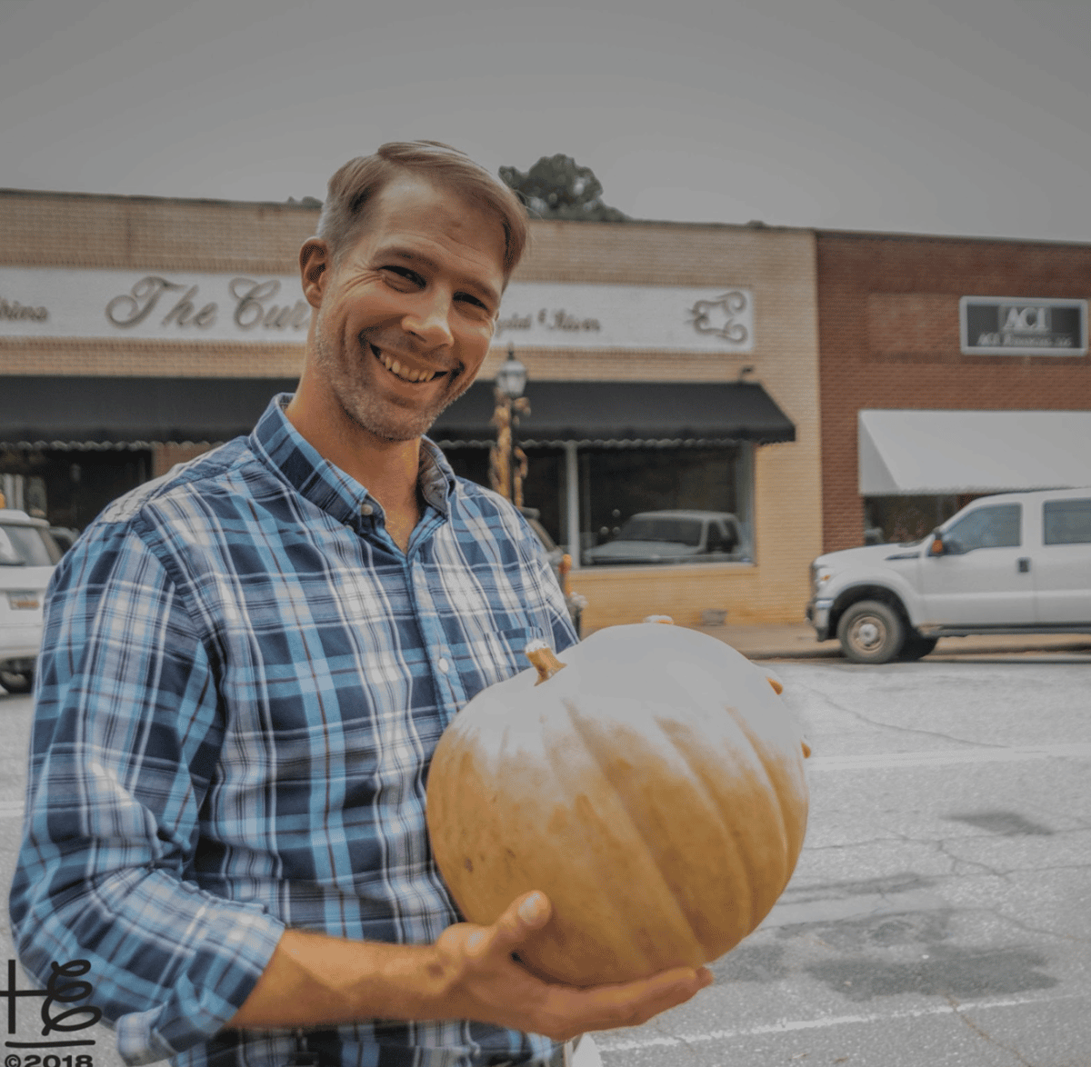man with pumpkin