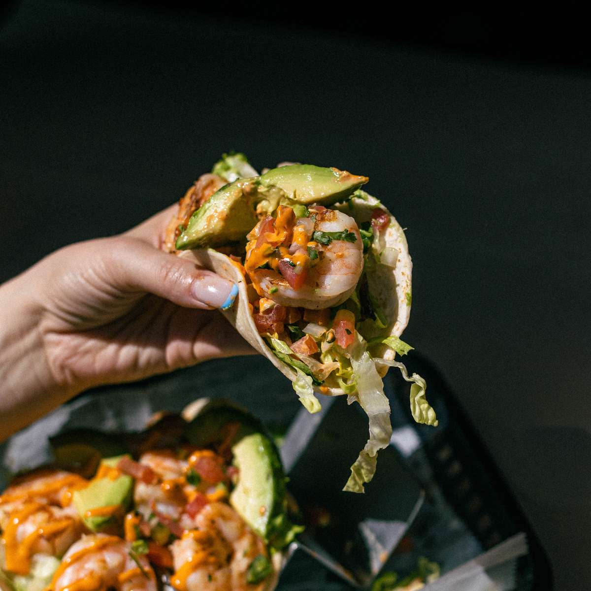 holding taco