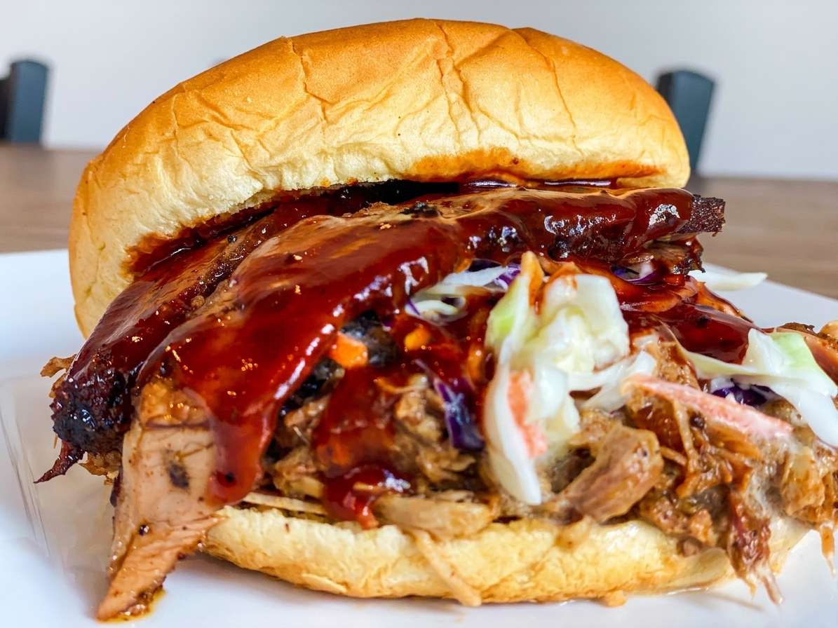 Tennessee-style pulled pork sandwich with slaw at Fainmous BBQ Pearland Texas