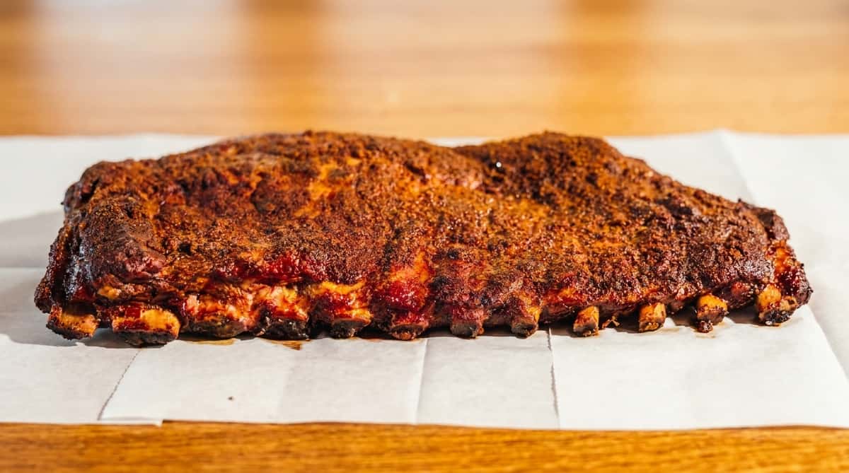 Hickory-smoked BBQ ribs with dry rub from Fainmous BBQ in Pearland TX