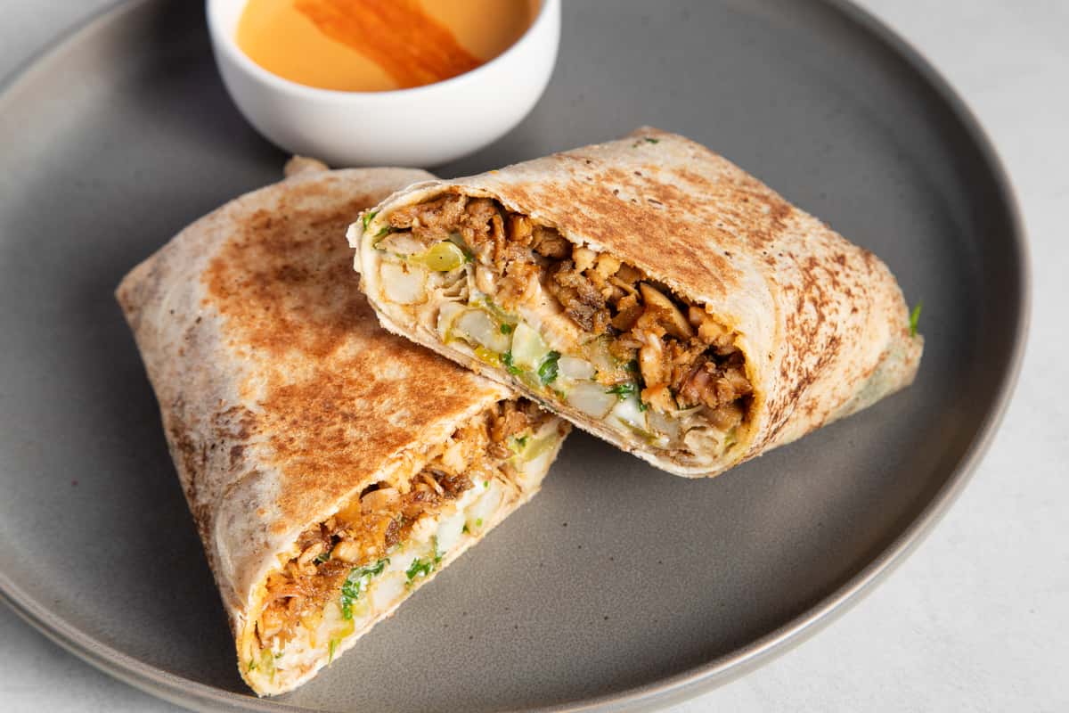 Classic Shawarma cut in half on a gray plate