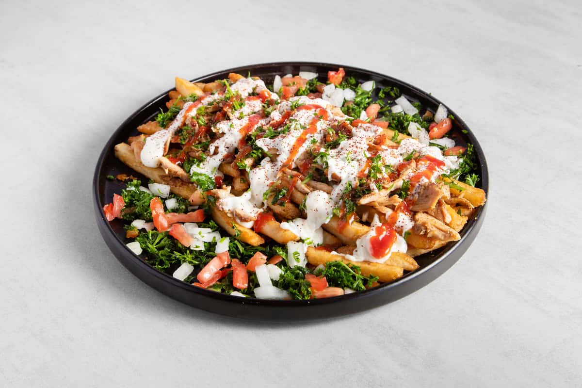 Supreme Chicken Shawarma on a black plate