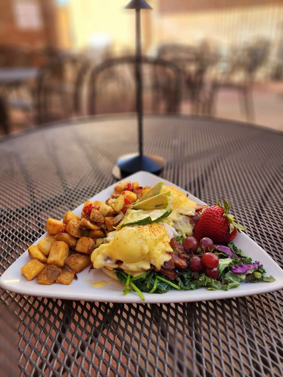 bacon, two chicken or duck poached eggs, avocado, spinach, tomato & hollandaise sauce on a toasted english muffin