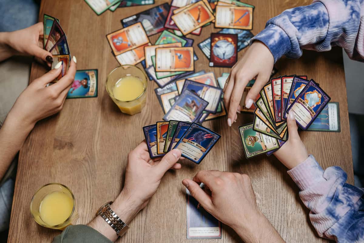 Hands holding cards