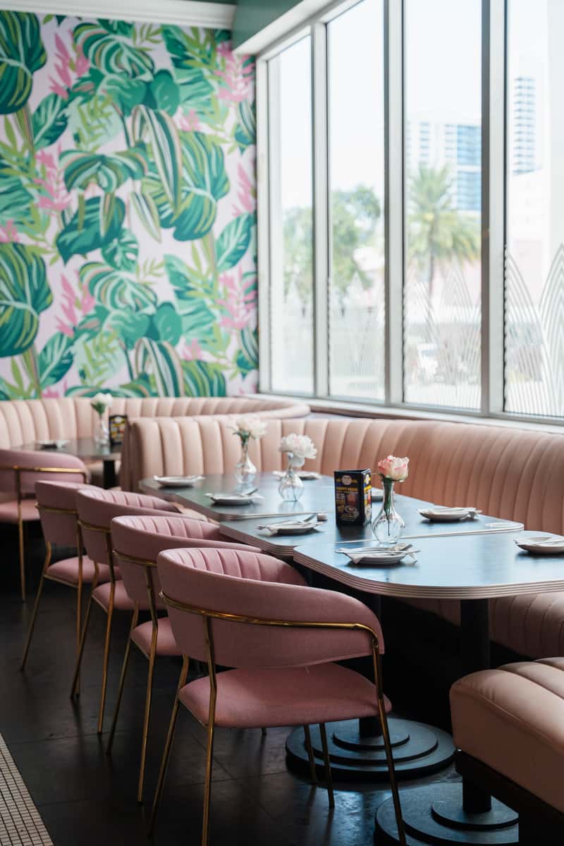 Interior view of the Miami, Florida location with pink booth seating and cushioned seat