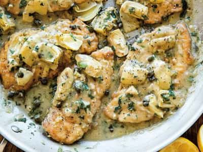 chicken piccata with lemon, artichokes, capers, and a cream sauce