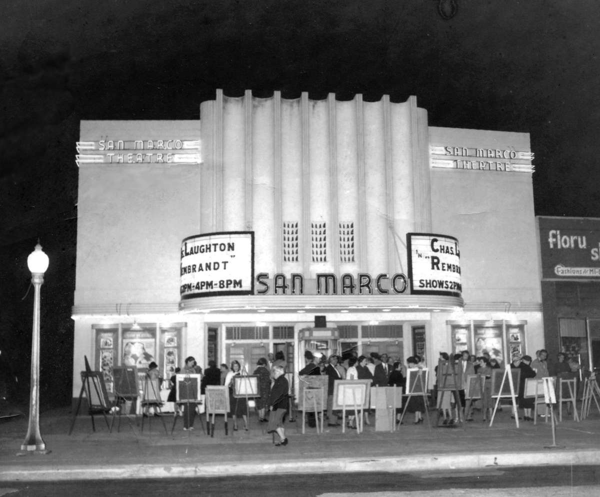 The San Marco Theatre marquee lit at night in its early years, with a crowd gathered on the sidewalk in San Marco, Jacksonville.