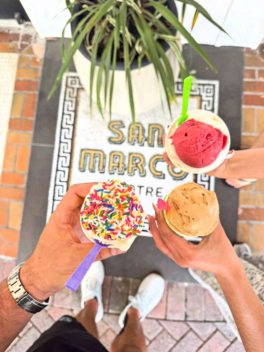 Cups of Italian gelato and sorbetto held over the original San Marco Theatre mosaic at the entrance to Electric Dough Pizza Co. in Jacksonville.