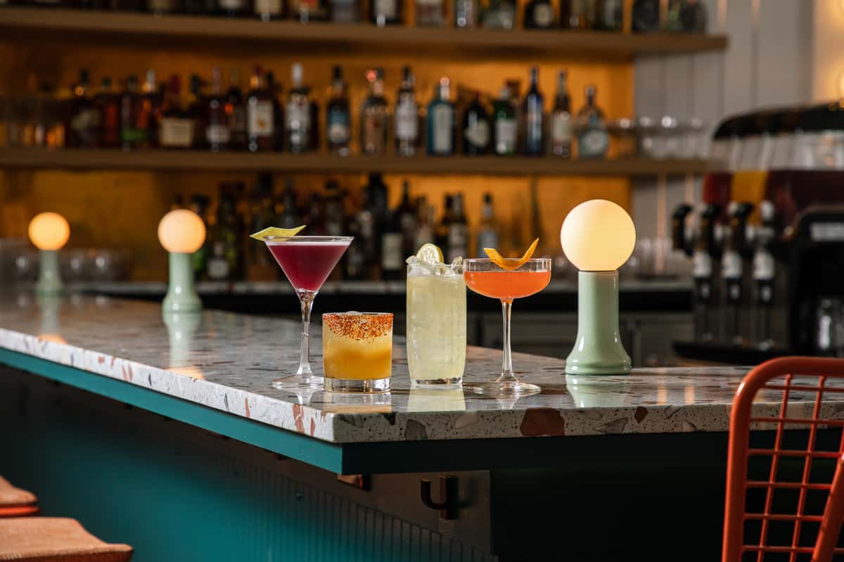 The terrazzo bar at Electric Dough Pizza Co. in San Marco, Jacksonville, set with cocktails.