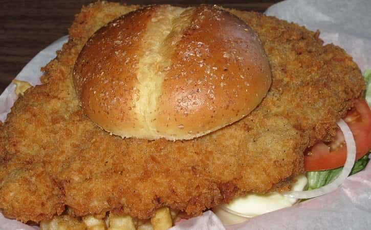 large fried chicken sandwich with french fries