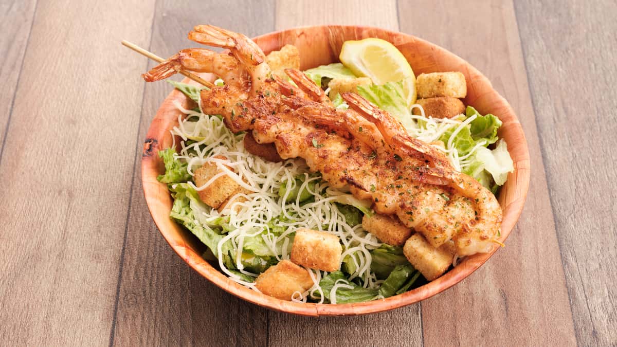 shrimp skewer with caesar salad