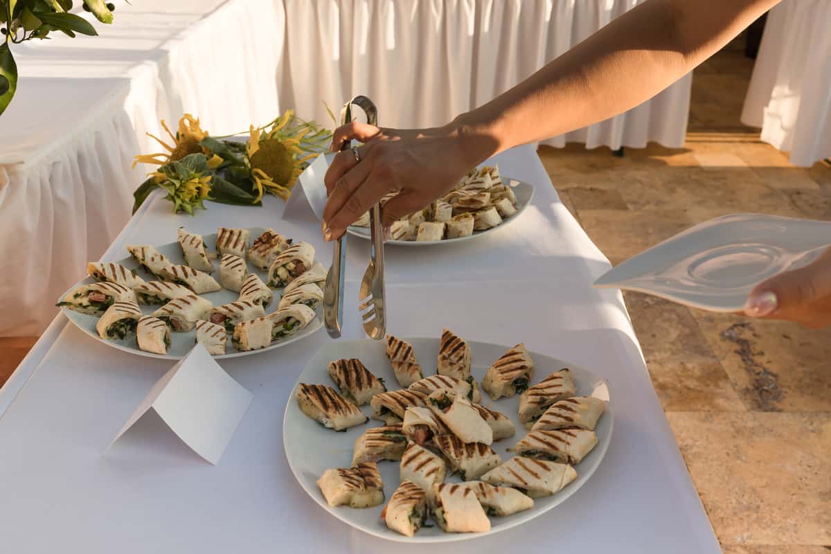 Person picking food on a buffet