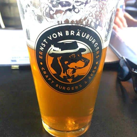 Ernst Von Brauburgers pint glass half full of beer