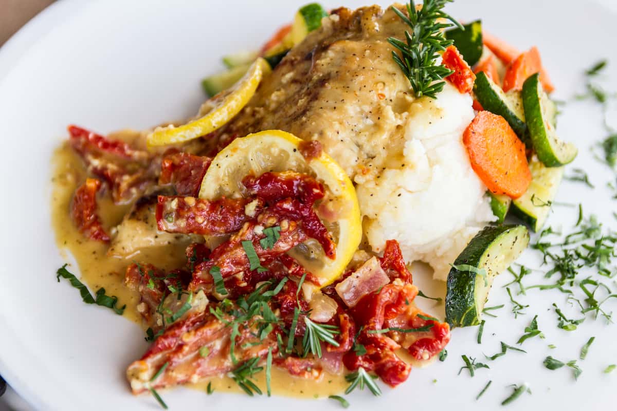 Lemon Butter Chicken with mashed potatoes and vegetables
