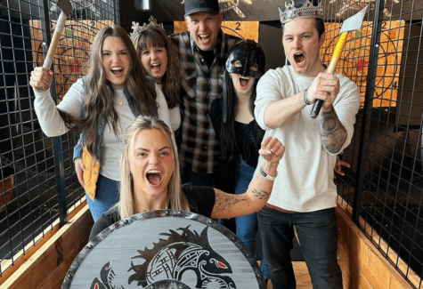group of axe throwers showing off their battle cry at Hopworks