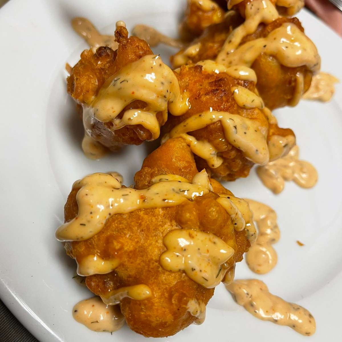 Crispy, golden Shrimp Fritters stuffed with fresh Gulf shrimp