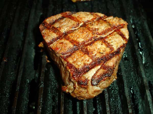 cooked steak on the grill
