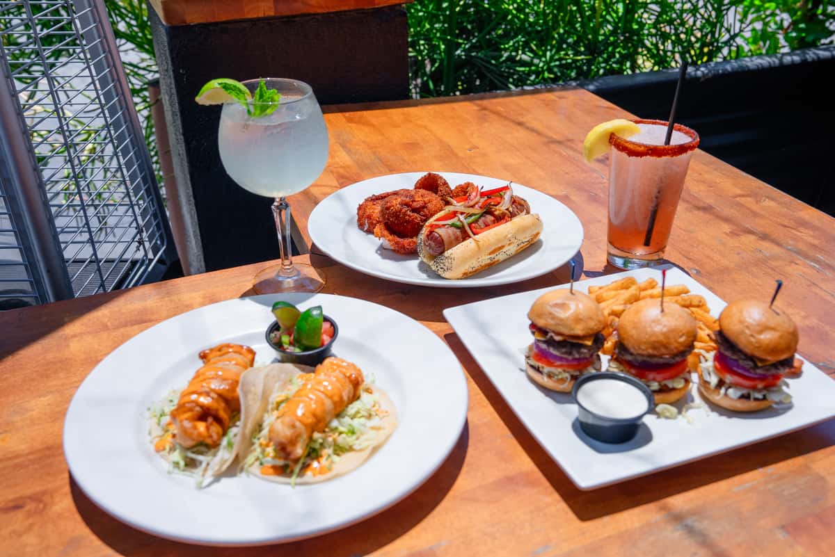 Fish tacos, hot dog and onion rings, sliders, frozen cocktails, and spritz
