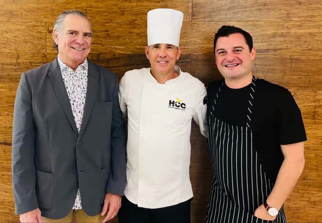 Chefs Michael CordĆŗa, Carlos Gamboa, David CordĆŗa pose for a picture at HCC's Culinary Arts Building.