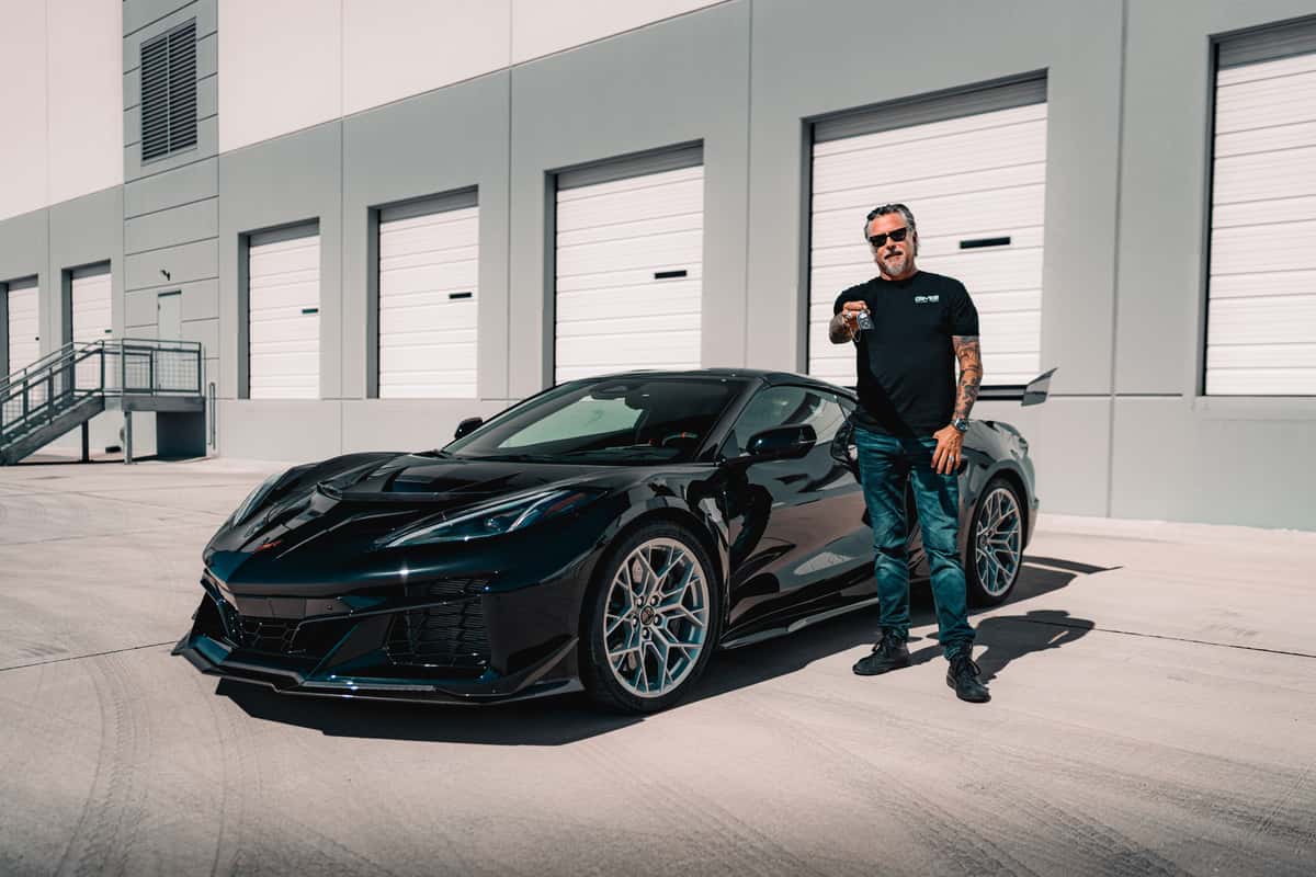 Richard next to a car giveaway