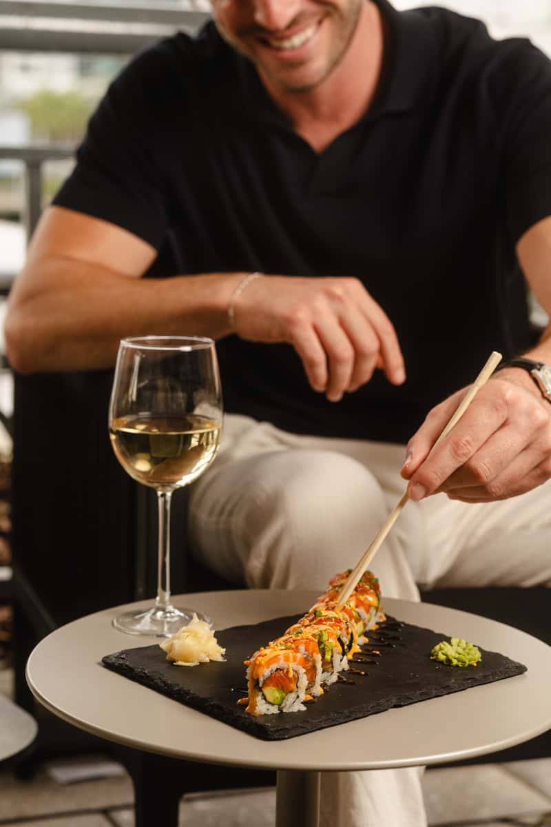 Crazy Salmon Roll and white wine glass